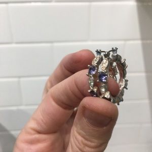 Silver, with faux stones hoop earings.